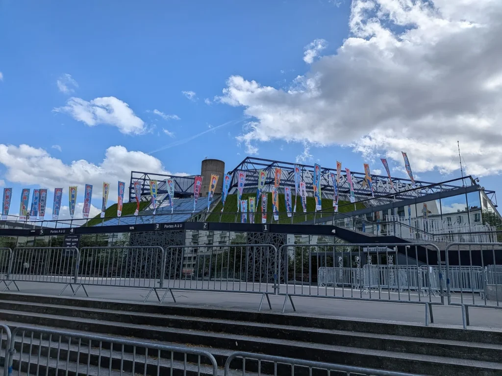 Exterior of the Accor Arena in the Bercy district of Paris, showing its grass-covered sloped walls