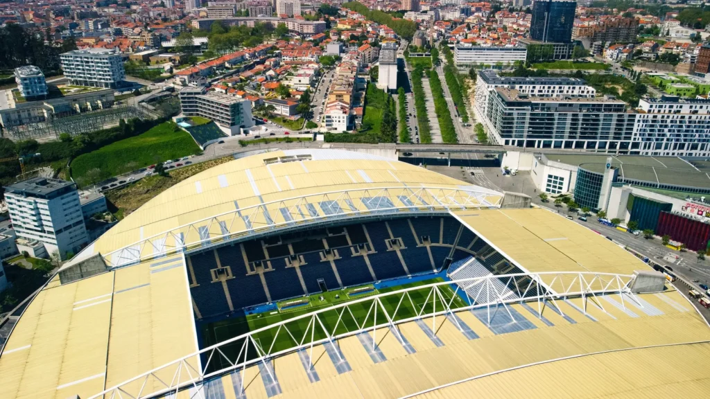 Aerial view of the Estadio do Dragao in Porto, its oval roof surrounded by the apartment blocks of the eastern city.