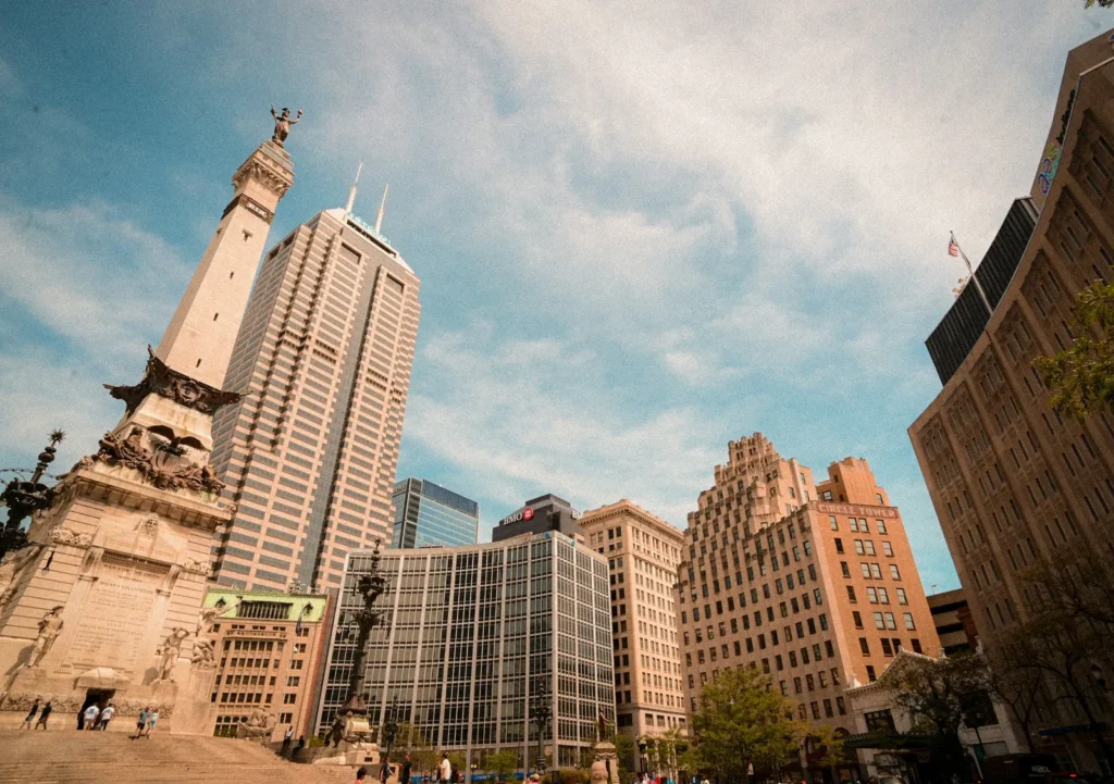 Soldiers' and Sailors' Monument at the center of Monument Circle with the downtown Indianapolis skyline rising behind it